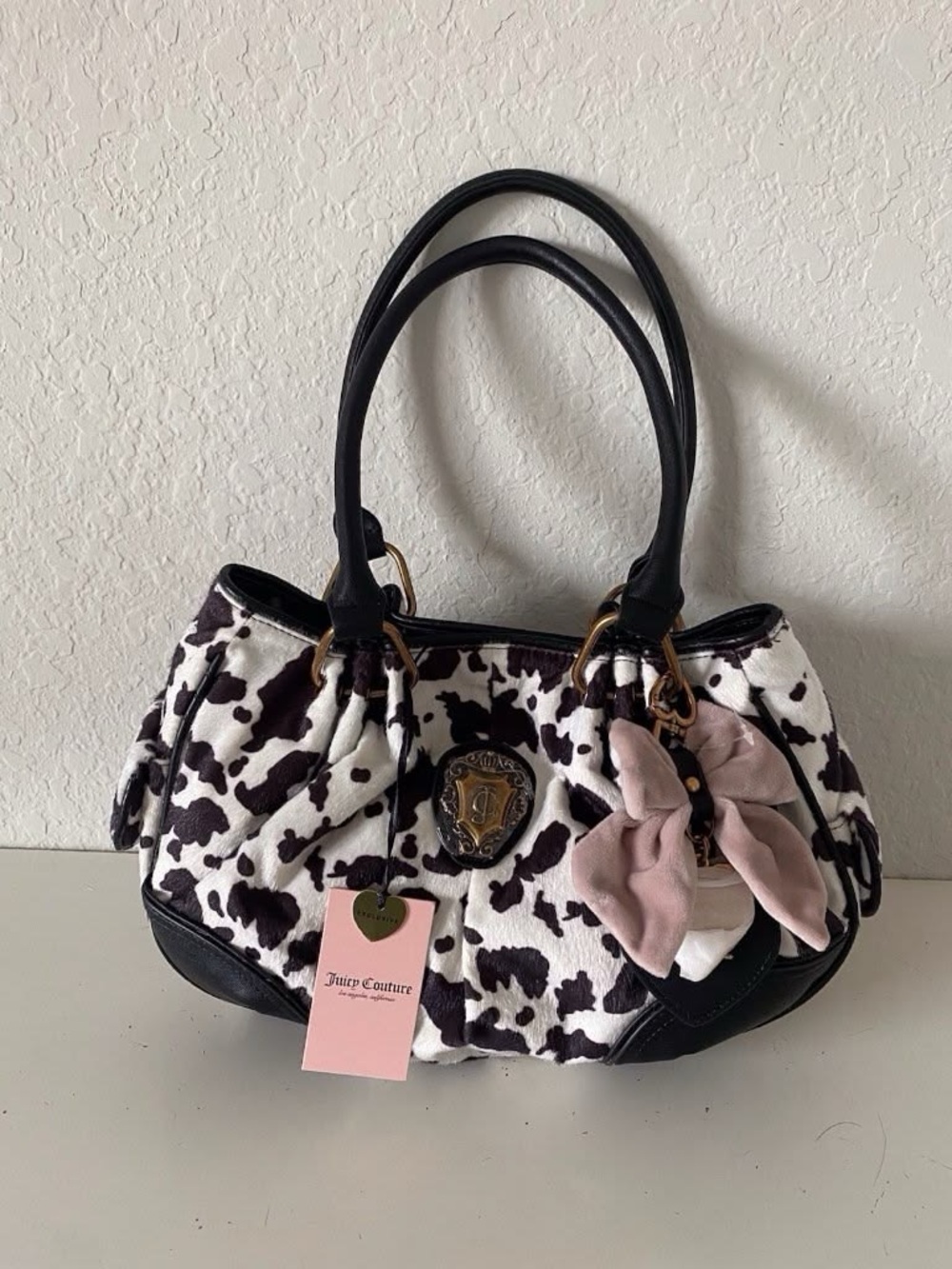 Juicy Couture Black & White Cow Print Satchel with Pink Bow Charm